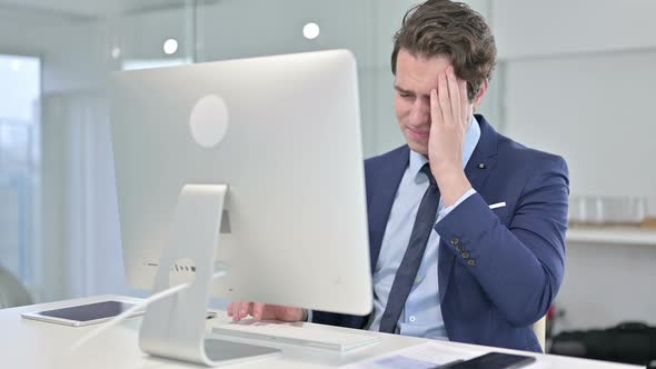 Hardworking Young Businessman Having Neck Pain