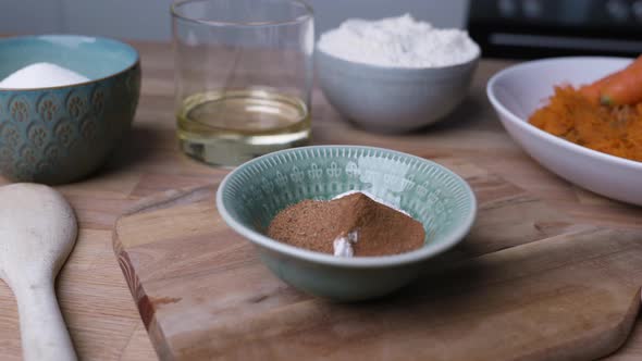 Baking Ingredients For Carrot Cake On Wooden Kitchen Table - close up