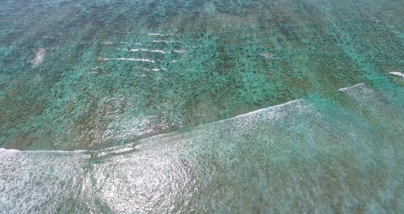 Daytime flying abstract view of a summer white paradise sand beach and blue sea background