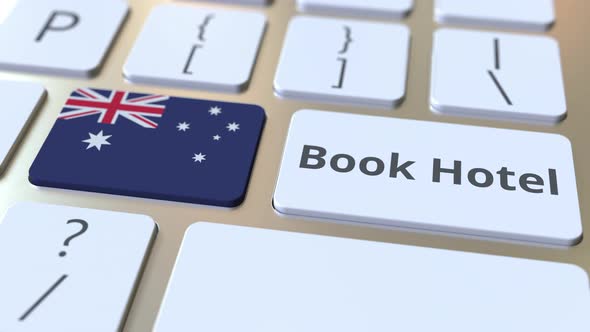 BOOK HOTEL Text and Flag of Australia on Computer Keyboard