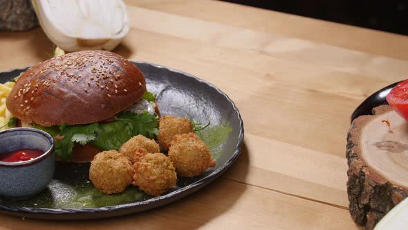 Tasty Burger with Falafel on a Rustic Wooden Surface