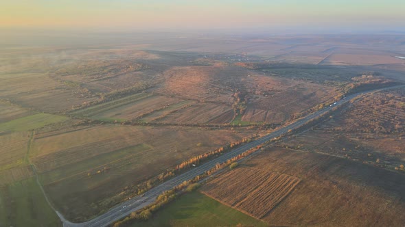 Panorama Mountain Road Aerial View in the Majestic Dramatic Sunset in the Valley Landscape