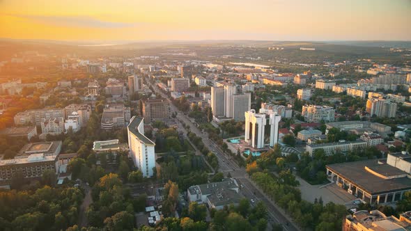 Aerial drone view of Chisinau downtown at sunset. Panorama view of multiple buildings, Parliament, P