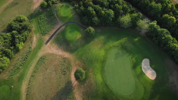 Green golf fields from bird's eye view