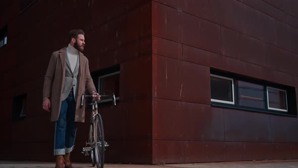 Man Pushing Bicycle Clothes in Coat