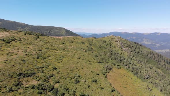 Aerial Panoramic View of Green Mountain Range and Hills in Valley of Carpathian