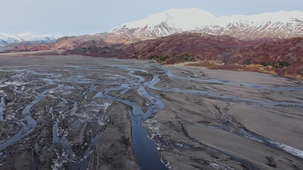 Drone Over Hvannagil Canyon And Estuary Towards Mountains