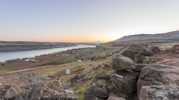 Day to night timelapse of scenic landscape in Oregon with majestic Mt. Hood in the distance 