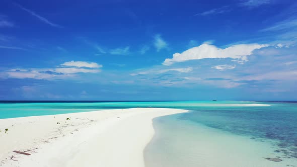 Beautiful fly over clean view of a summer white paradise sand beach and blue ocean background in bes