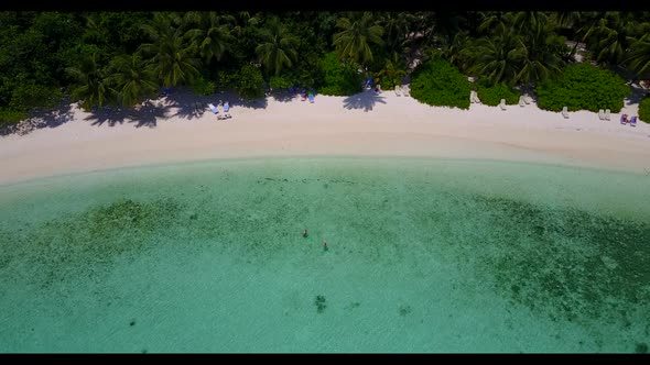 Aerial scenery of idyllic seashore beach journey by turquoise lagoon and white sandy background of a