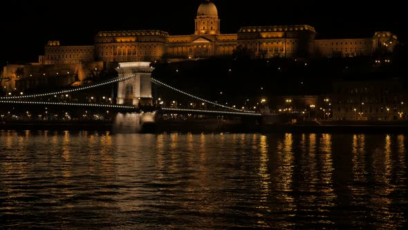 Szechenyi  Bridge and royal palace on Buda hill Budapest by night 4K 2160p UltraHD footage - Beautif