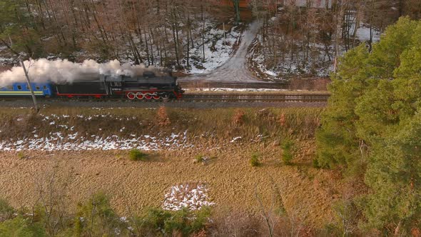 Aerial View of Vintage Steam Engine Train Puffing Smoke