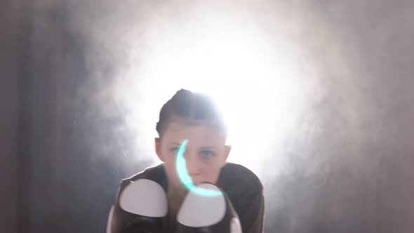 Portrait of a Teen Girl Boxer Working Out the Bumps in the Ring