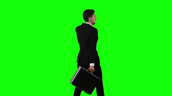 Man Goes To Work and Talks on the Phone. Green Screen
