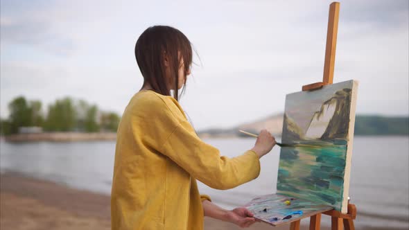 Woman Painting Oil Picture with Inspiration and Passion