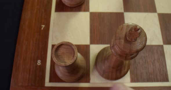 Close Up Top View of Player Making Castling Move Protecting King Playing Wooden Chess