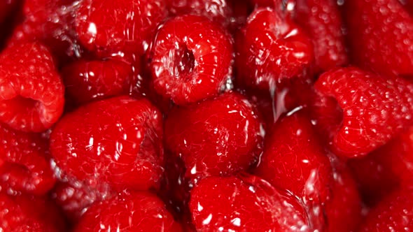 Super Slow Motion Shot of Splashing Water To Fresh Raspberries at 1000Fps.