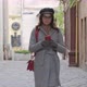 Young Beautiful Girl In Glasses With A Smartphone Walks Down The Street Of The Old City - VideoHive Item for Sale
