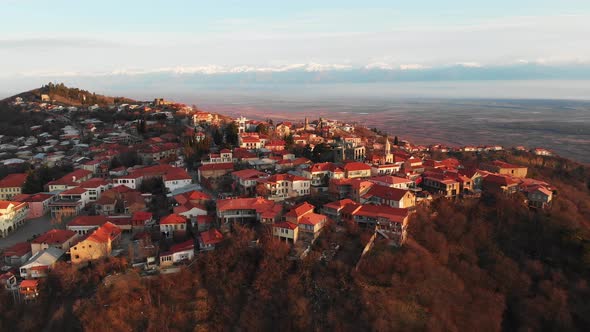 Aerial Panorama Of Sighnaghi With Caucasus Mountains