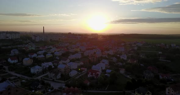 Village houses near the big city, shooting from a quadcopter