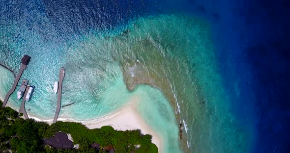 Wide angle fly over abstract view of a paradise sunny white sand beach and turquoise sea background 