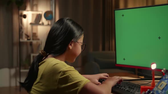 Engineer Asian Girl Is Working With Desktop Computer In Home, Mock Up Green Screen Display