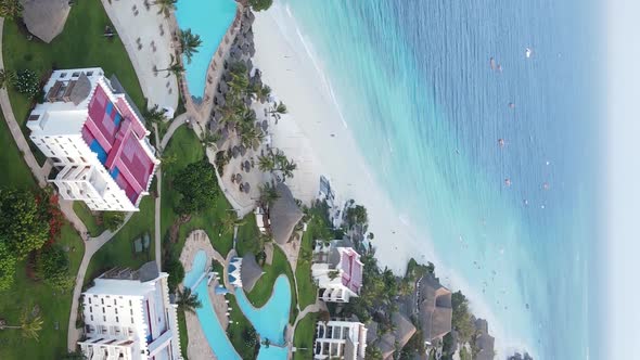 Vertical Video Boats in the Ocean Near the Coast of Zanzibar Tanzania Aerial View