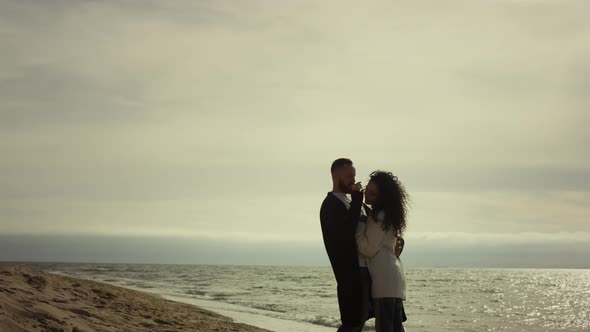 Couple Holding Each Other at Sea