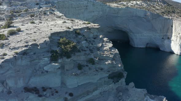 Aerial Over Mountain Revealing Paradise Bay with Caves