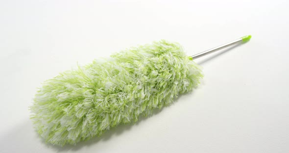 Close-up of green cleaning duster