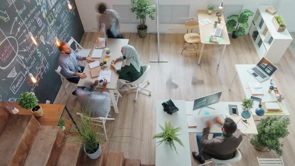 High Angle View Time Lapse of People Colleagues Working in Creative Office Together Moving