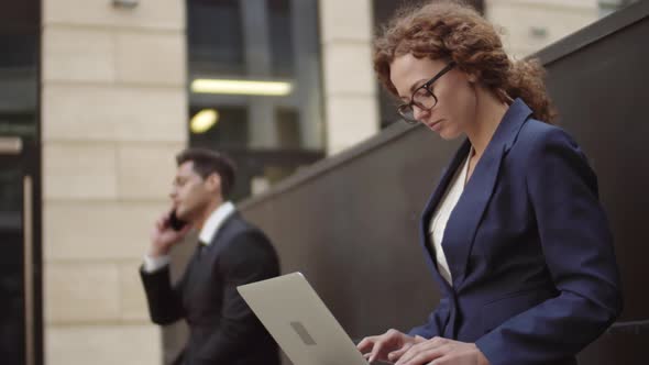 Two Businesspeople Working Outdoors