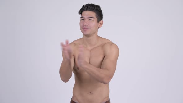 Happy Young Handsome Muscular Shirtless Man Clapping Hands