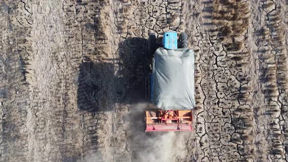 Tractor plowing in farm