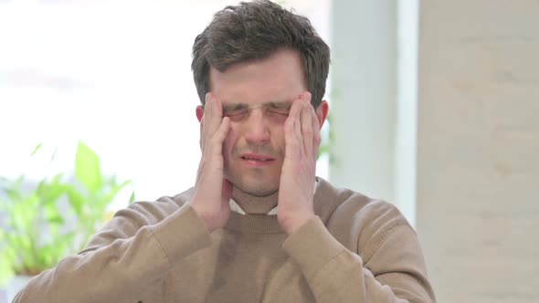 Portrait of Man Having Headache