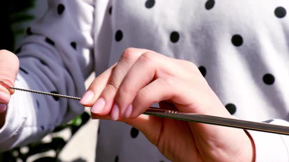 Slow Motion Woman Cleaning Reusable Metal Straw