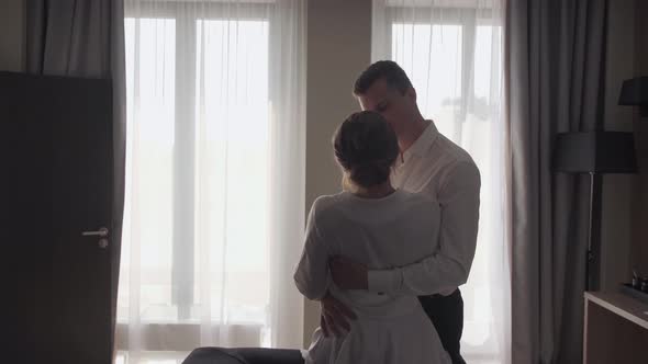 Bride and Groom in a Hotel Room