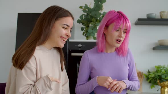 Portrait of Female with Physical Disability and Friend Chatting on Video Call