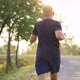 Sporty teenage boy running on natural park road with sunset time. - VideoHive Item for Sale
