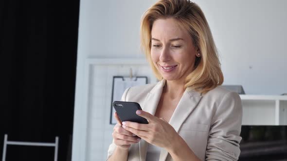 Friendly Women Reading Email at Work