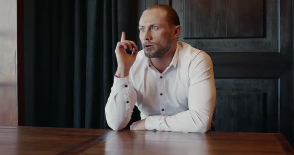 Thoughtful Executive Man Thinking About Problem and Searching for Solution in Modern Conference Room