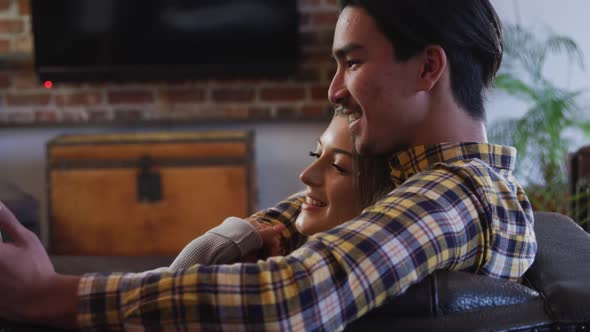 Happy couple spending time together in their house