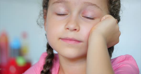 Portrait of Little Cute Girl Looking the Camera