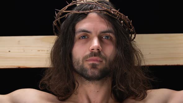 Face of Crying Jesus Christ Crucified on Cross Looking at Camera, Son of God