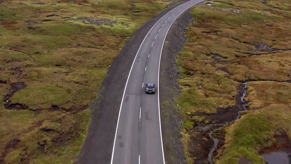 Drone Flight Tracking Car Driving Along Empty Road