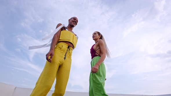 Dancers In Clubwear Dancing And Performing Together On Skyscraper