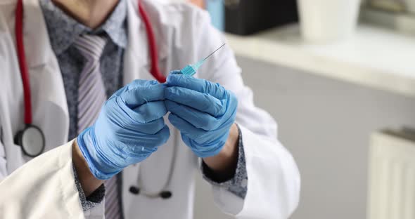 Doctor in Gloves Holds Syringe with Vaccine  Movie