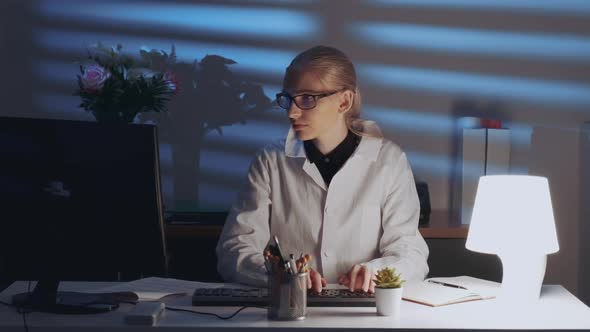 Smart Female Engineer Working on Computer and Enjoying Success in Work