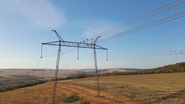 High Voltage Tower with Electric Power Lines Transfening Electrical Energy Through Cable Wires