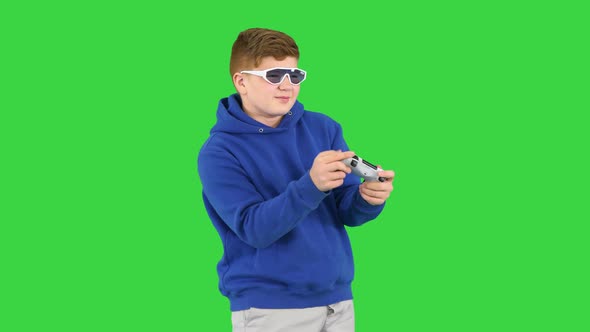Teenager Actively Playing Video Game on a Green Screen Chroma Key
